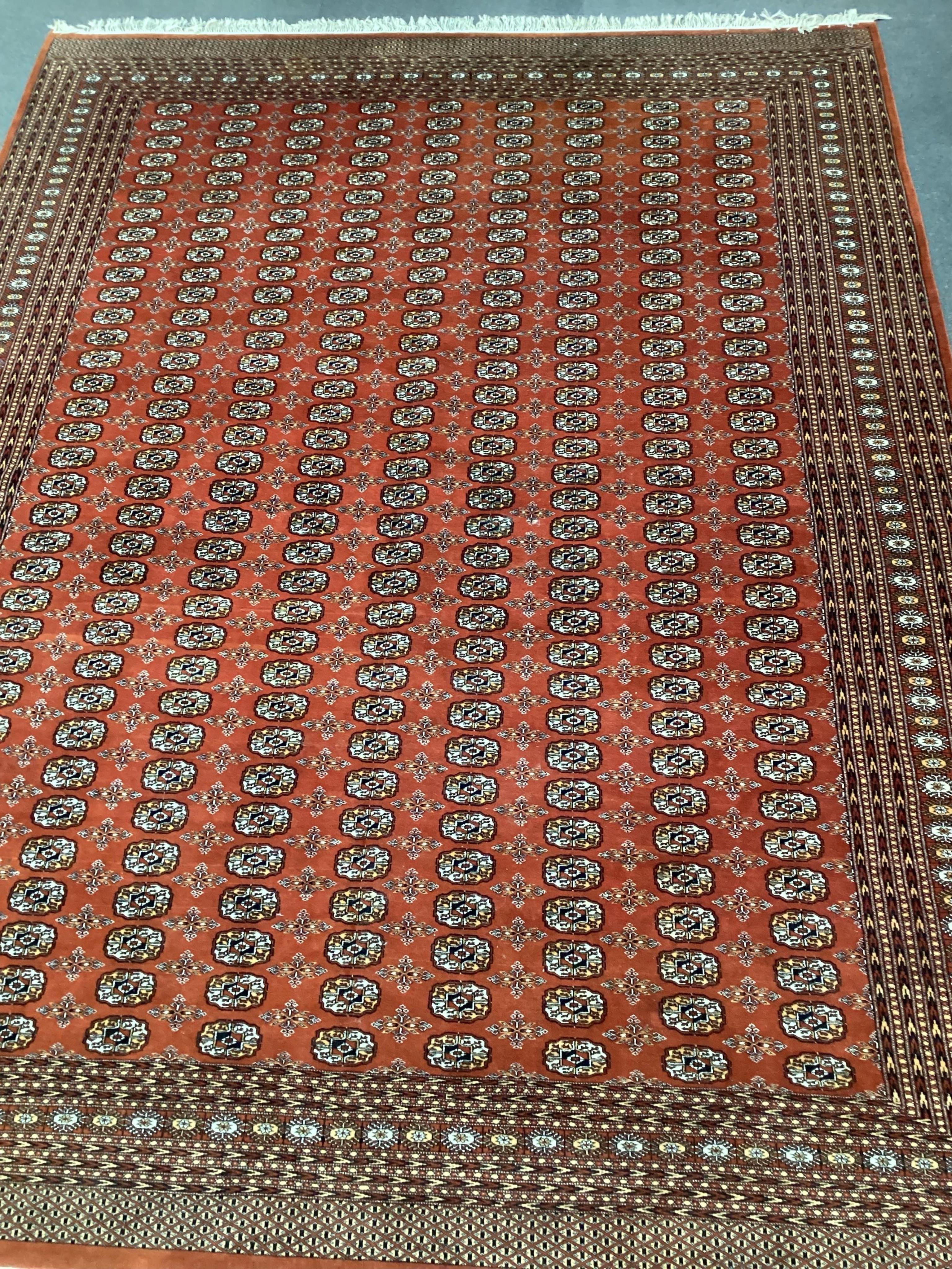 A Bokhara red ground carpet, 410 x 310cm. Condition - good